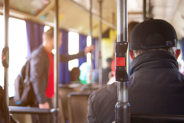 stop button modern and comfortable interior of the city bus. Convenient for disabled and elderly people