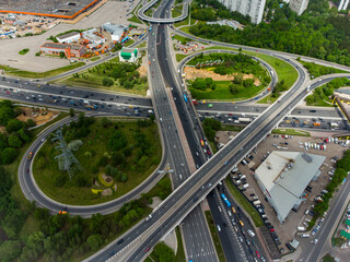 Busy multilevel junction in summer in outskirts