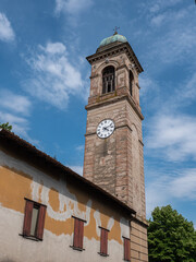Fototapeta na wymiar Bell Tower of the Church of San Giacomo Apostolo in Cadè in the province of Reggio nell'Emilia, Italy
