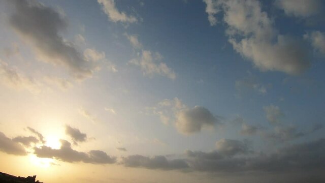 4K Time lapse of the clouds in the sky during the sunset	