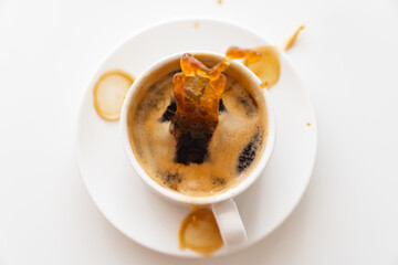 View top. from cup of coffee scatter splashes on the white table