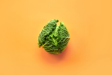 Fresh savoy cabbage on color background