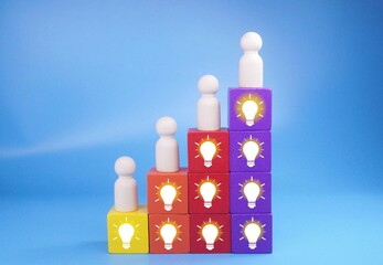 peg dolls, colored cubes, light bulbs conceptualized