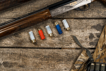 Various hunting equipment on old wooden background
