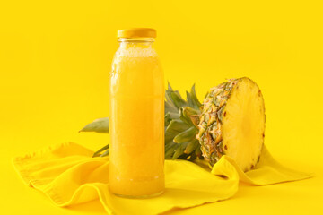 Bottle of tasty pineapple smoothie on color background
