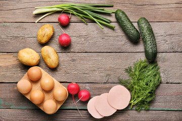 Frame made of ingredients for okroshka on wooden background