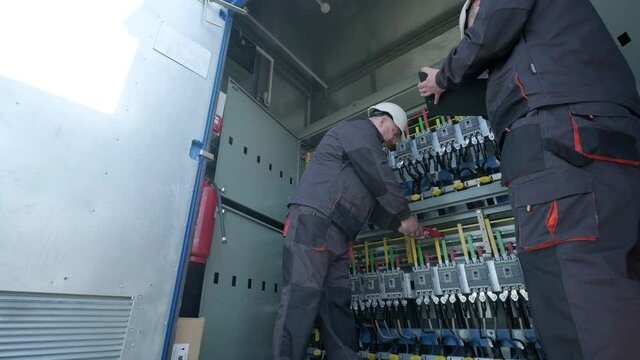 Checking the operating voltage levels of the solar panel switchgear compartment