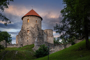Cesis medieval castle at sunset. Latvia - obrazy, fototapety, plakaty