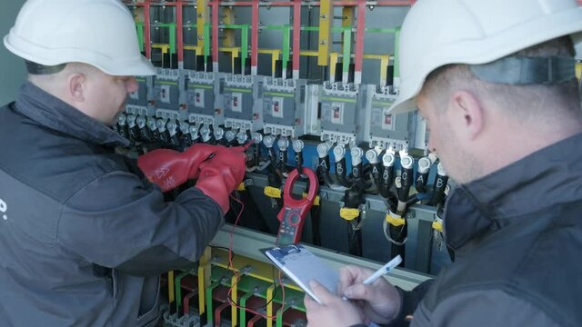 Checking the operating voltage levels of the solar panel switchgear compartment