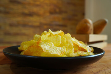 Potato crisps served in a bowl.