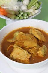 Southern Thai Spicy Sour Yellow Curry with Sea Bass and Coconut Shoots, Sour soup made of Tamarind Paste or Turmeric.