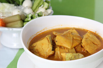 Southern Thai Spicy Sour Yellow Curry with Sea Bass and Coconut Shoots, Sour soup made of Tamarind Paste or Turmeric.