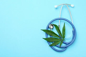 Medicinal cannabis concept on blue background, space for text