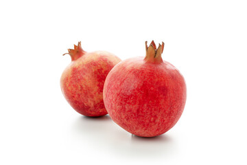 Ripe pomegranate fruits isolated on white background