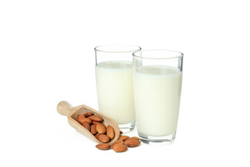 Glasses of milk and nuts isolated on white background