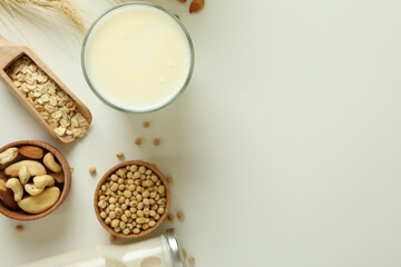 Concept of vegan milk on white background, top view