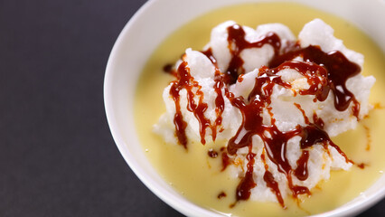 bowl of floating island with caramel