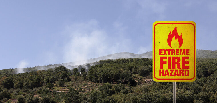 Extreme fire hazard banner with forest fire in the background.