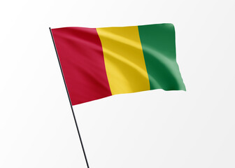 Guinea flag flying high in the isolated background Guinea independence day. World national flag collection