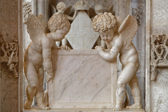 BOURG-EN-BRESSE, FRANCE, June 29, 2021 : Angels on graves in gothic Brou monastery church