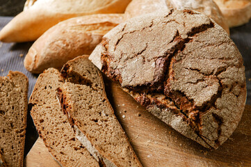 loaves and slices of bread, rye and wheat bread,