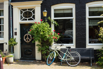 Fototapeta na wymiar Amsterdam summer street view with flowers
