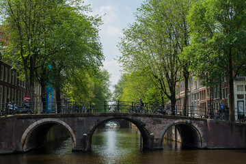 Fototapeta premium canal houses, bridges, and canals in Amsterdam