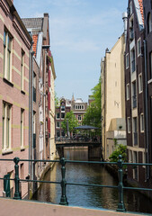 Fototapeta na wymiar canal houses, bridges, and canals in Amsterdam