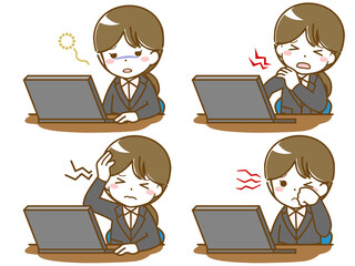 パソコン作業で疲れるスーツの若い女性