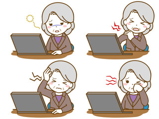 パソコン作業で疲れるスーツの高齢女性