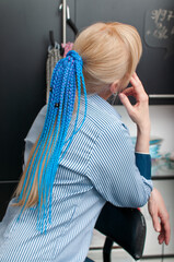 Blond woman with blue braids