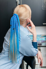 Blond woman with blue braids