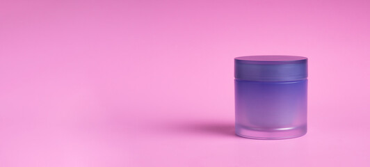 The bottle of lotion or cream isolated on pink background. Shadows blur on the floor