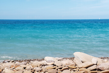 Fototapeta na wymiar Rocky long beach of mediterranean tyrrhenian sea in Piombino, Toscana, Italy.