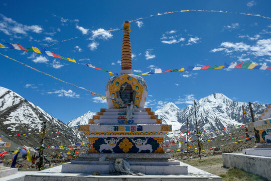Dhar Thachakarpo, India - June 2021: A Buddhist stupa at the high pass of Kunzum La in Spiti valley with a background of Himalayan mountains on June 27, 2021 in Himachal Pradesh, India.