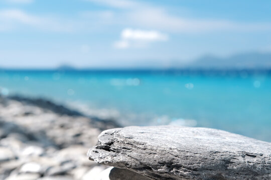 Stone rocky pedestal or podium in front of sea ocean background. Empty  product template. Summer vibe. Mock-up. Stage for advertising Stock Photo |  Adobe Stock