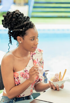 Afro American Woman Smiling And Eating A Sugar Free Ice Cream Desert