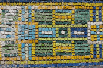 Colorful stone mosaic near the monument in the park