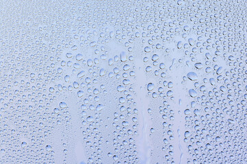 drops glass blue background abstract, transparent cold background water splashes
