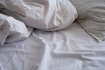 Fototapeta na wymiar Bed linen texture. White bed linen background. Bed. Interior.