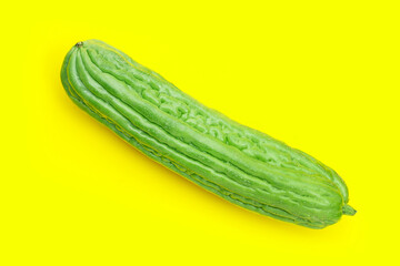 Bitter melon on yellow background.
