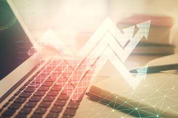 Double exposure of arrows drawing and desktop with coffee and items on table background. Concept of growth.