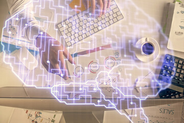 Double exposure of man's hands typing over computer keyboard and brain hologram drawing. Top view. Ai and data technology concept.
