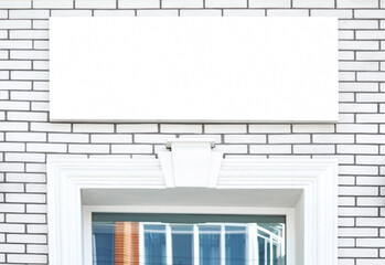 Mockup of a white signboard above the store entrance