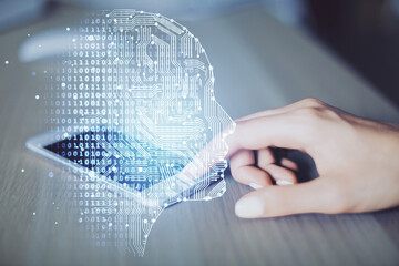 Double exposure of brain sketch hologram and woman holding and using a mobile device.