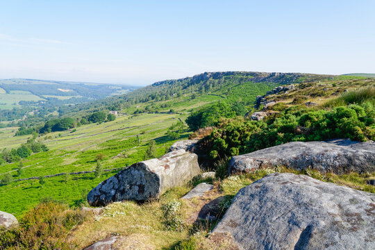 Early summer morning on Baslow Edge looking across towards Curbar Edge