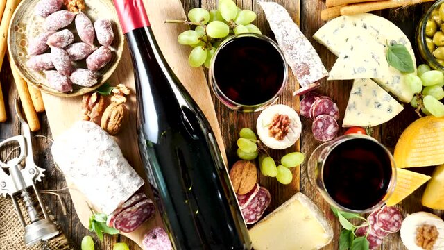 bottle of wine, cheese and salami composition