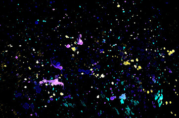 watercolor stains on black color, water color stains splatter, multicolored splash on the dark background