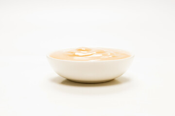Mushroom sauce in a bowl isolated on white background.