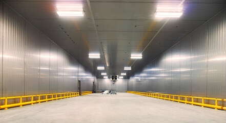 Metal interior building with yellow fence